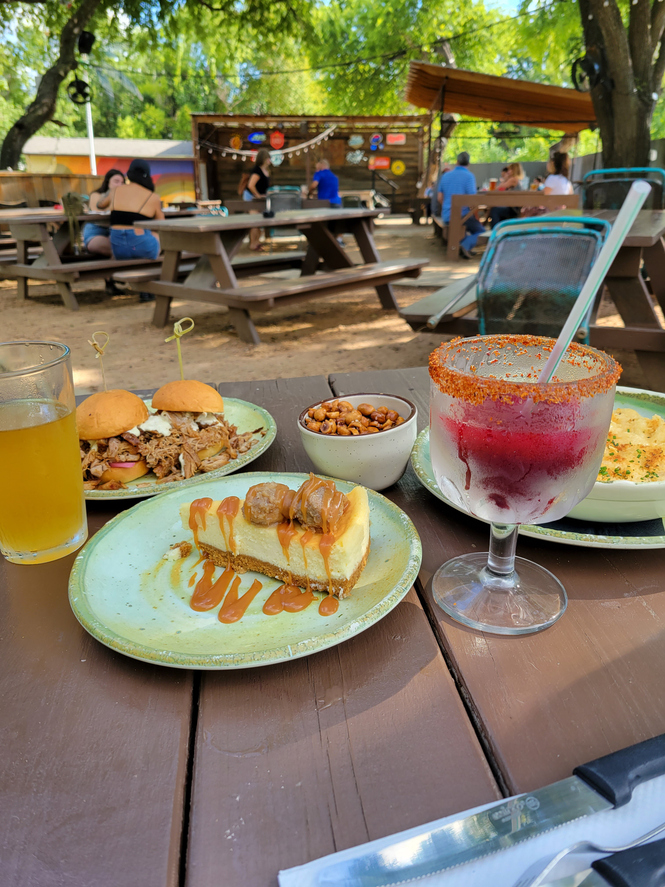 an outdoor dining venue with foods on the table in Austin, Texas