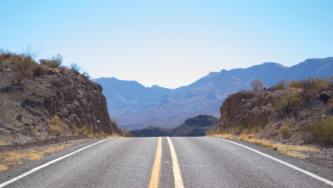 Center view of highway with mountains and Big Bend National Park in South Texas