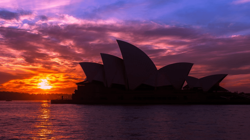 sunset, the silhouette of the Sydney Opera House, seawater, clouds
