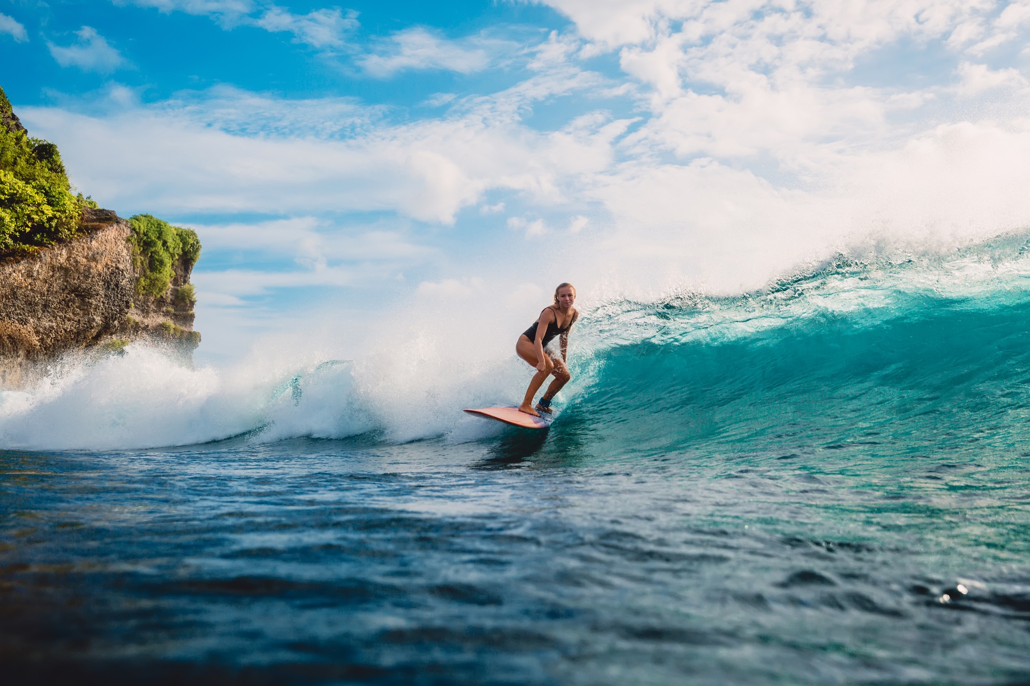 surf-girl-on-surfboard-woman-in-ocean-during-surfing-surfer-and-ocean-wave